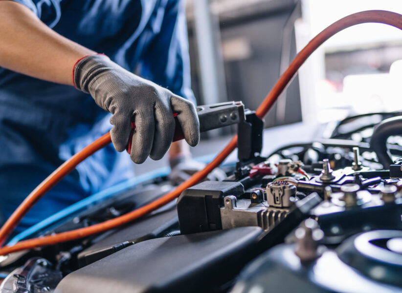 Maintenance worker in garage shop service to customer car via insurance system at garage, Safety vehicle to reduce accidents before a long travel, road trip transportation.